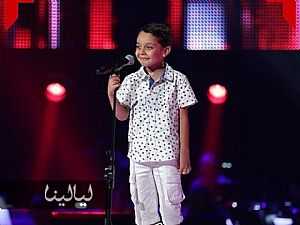 فيديو وصور طفل يجعل نانسي عجرم وتامر حسني يغنون له في The Voice Kids