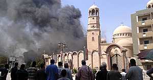 صورة توضح حرق الكنائس خلال المسيرات الخاصة بالاخوان